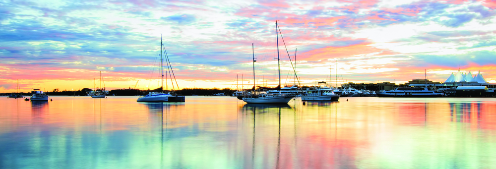 Boats on the water during sunset